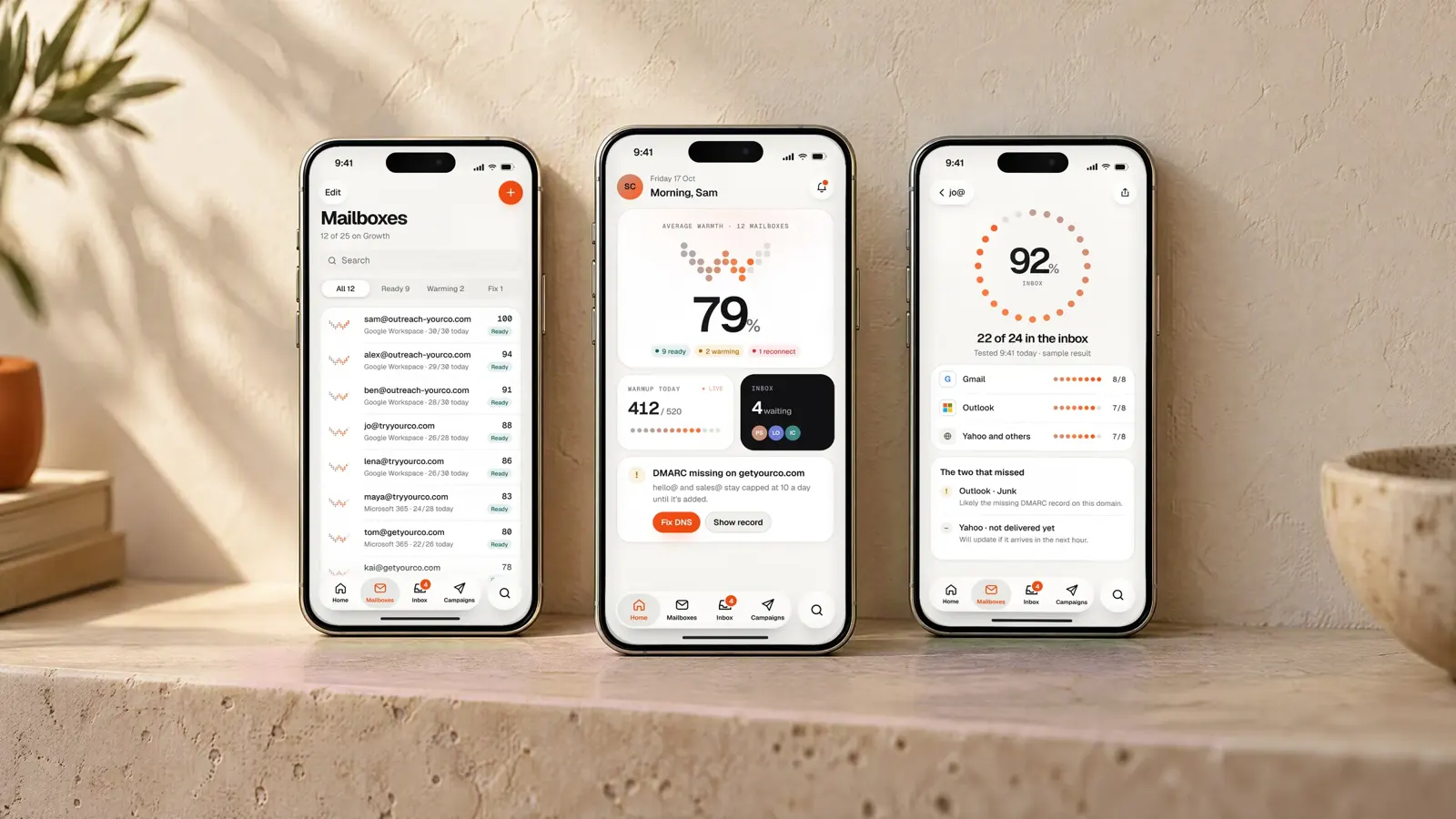 Three iPhone screens standing side by side: mailboxes, home and a placement result. Design renders with sample data.